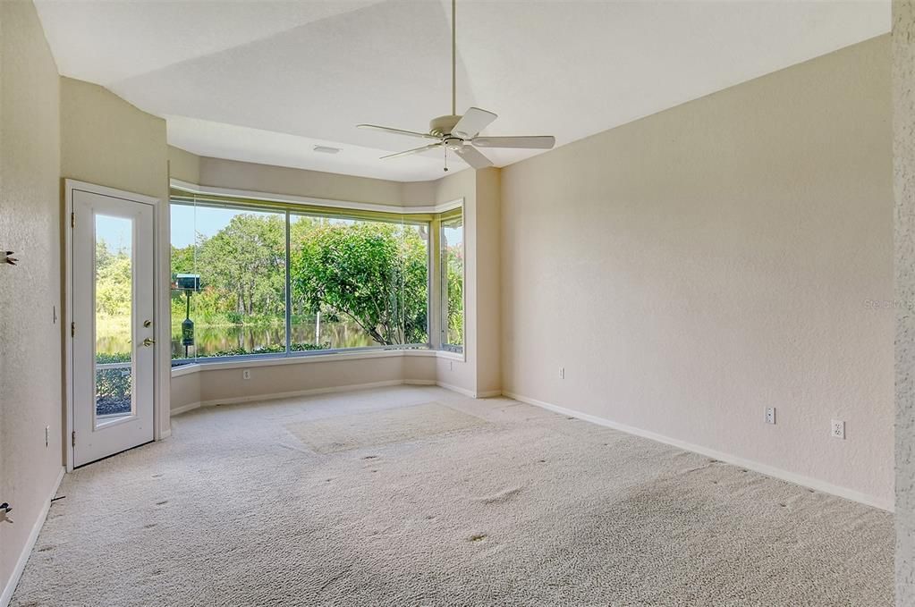 The Primary Suite has a lovely large window for viewing the lake