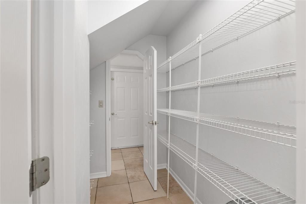 CONVENIENT WALK THRU PANTRY TO BACK HALL AREA