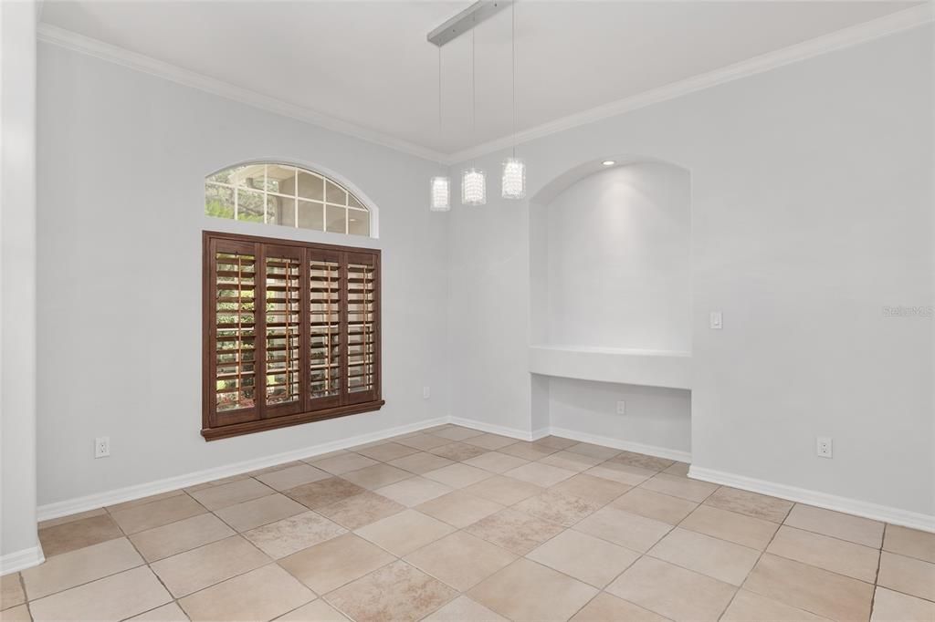 FORMAL DINING WITH NEW LIGHTING, ART NICHE AND PLANTATION SHUTTERS