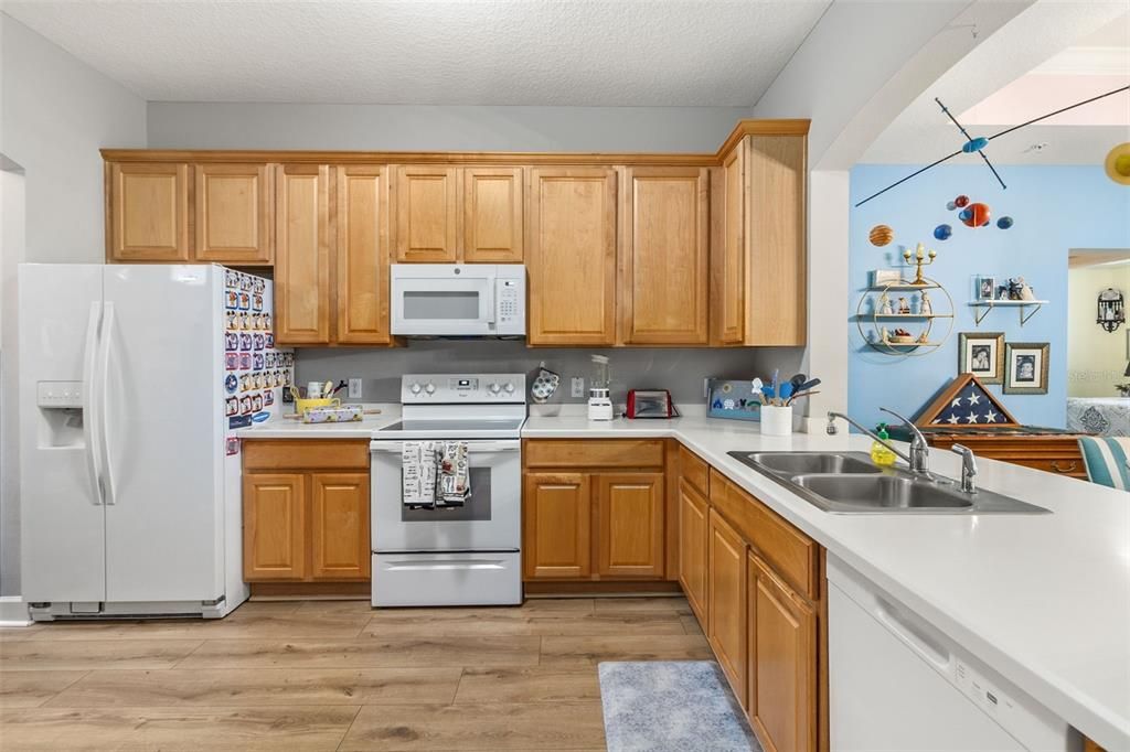 Fully equipped kitchen featuring ample space to enjoy the cooking experience: stone countertops, roomy 42" upper CABINETS