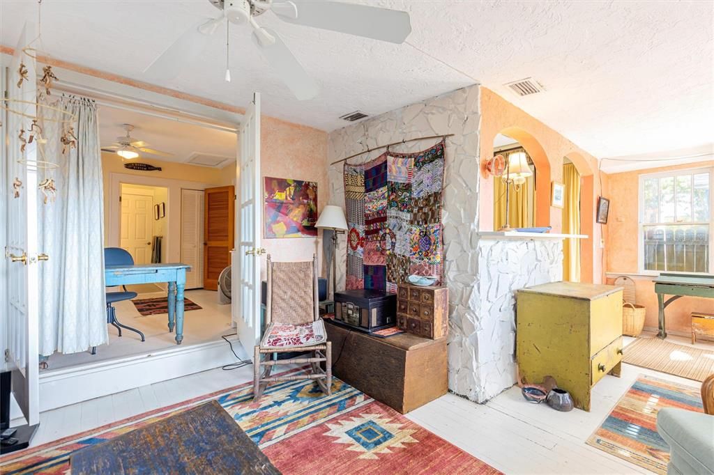 French doors into second bedroom off living room