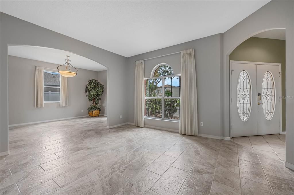 Living room looking into dining room and foyer