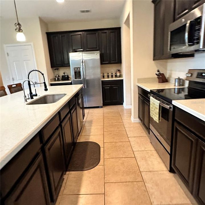 View behind breakfast bar work area of kitchen