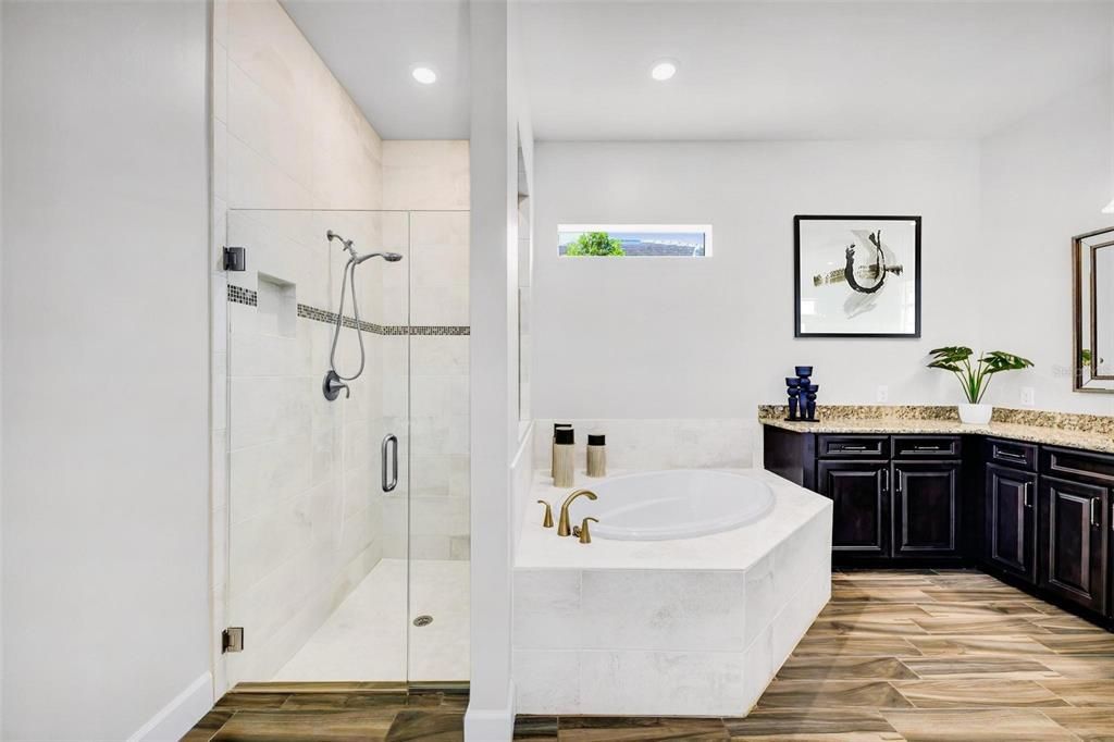 Primary bathroom with separate sink vanities