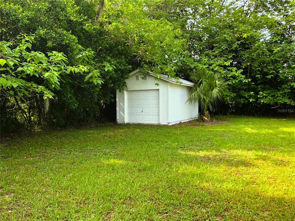 EAST SIDE OF HOME & CARPORT & ACCESSIBLITY RAMP TO FRONT DOOR