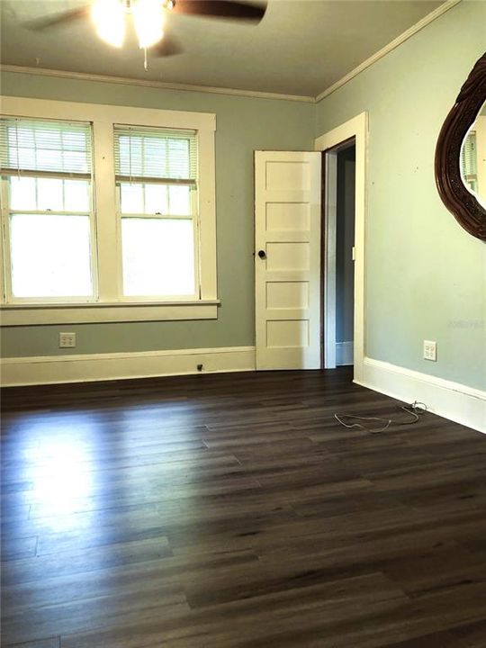 BEDROOM 3 CORNER TO RIGHT OF HALL DOOR LOOKING TO WEST SIDE WINDOW