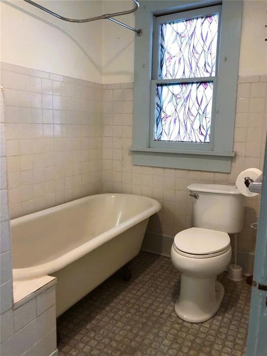 HALL LOOKING INTO GUEST BATH WITH VINTAGE " 4 LEGGED" TUB