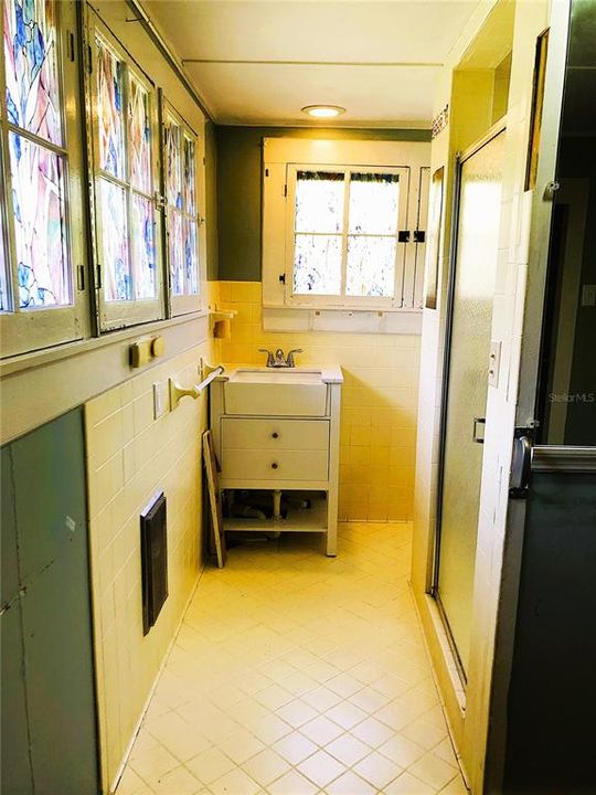 PRIMARY BATH DRESSING AREA AND BUILT IN CLOSET