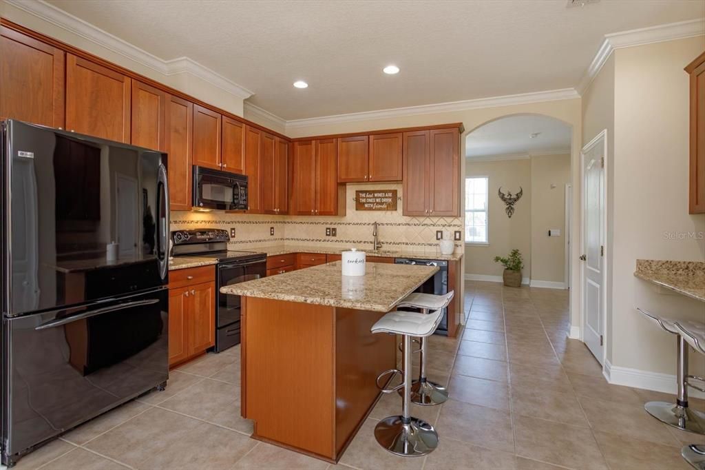 Granite counters and tile backsplash