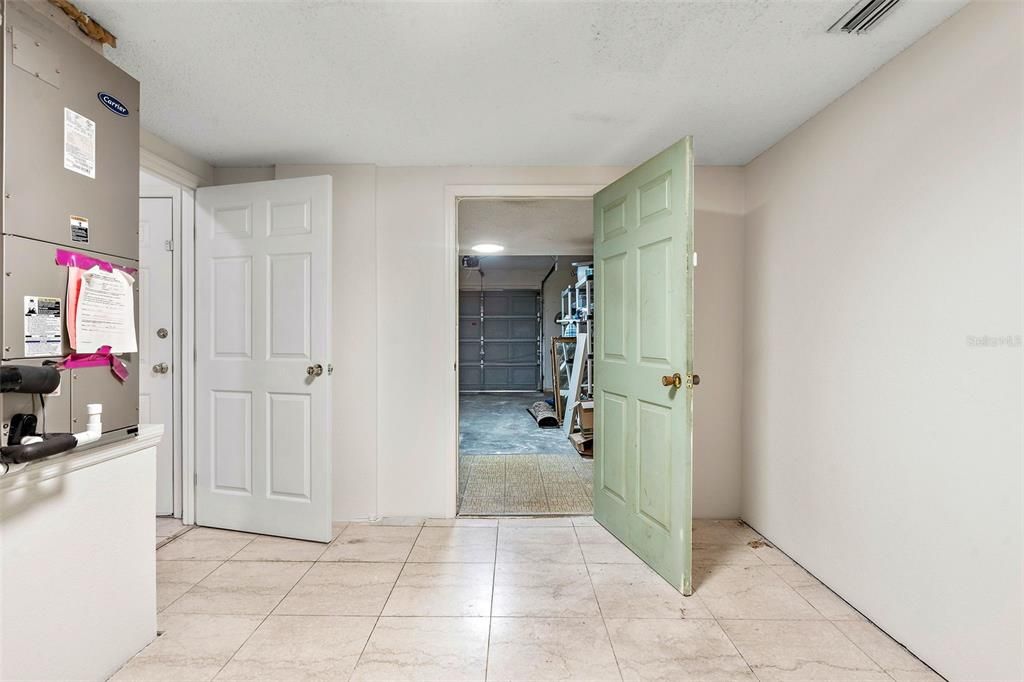 Laundry room looking into garage