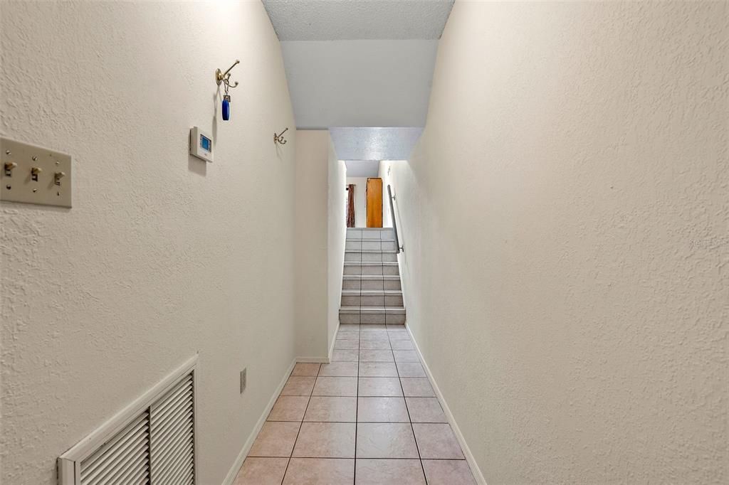 Interior entryway with stairs leading to main living floor