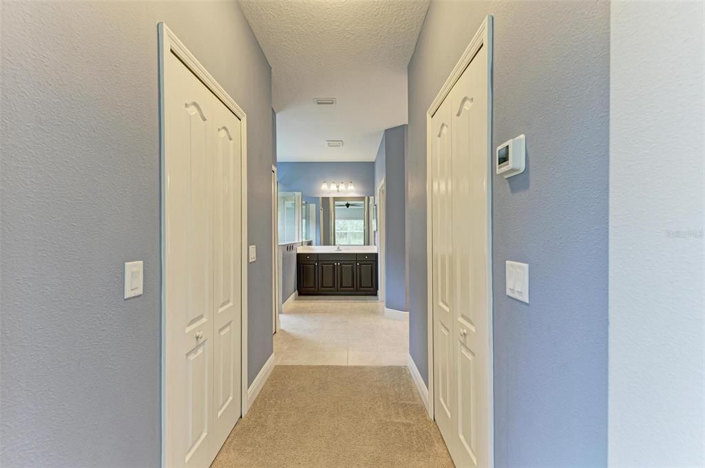 Dual closets into Primary Bathroom