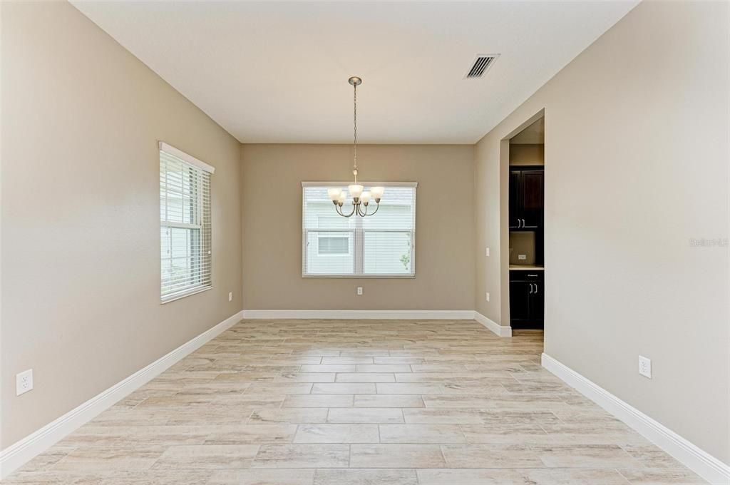 Dining area and kitchen door to the right