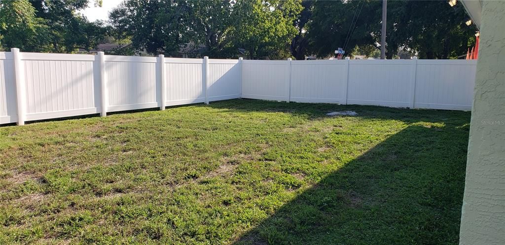 Side yard of corner pvc fenced yard