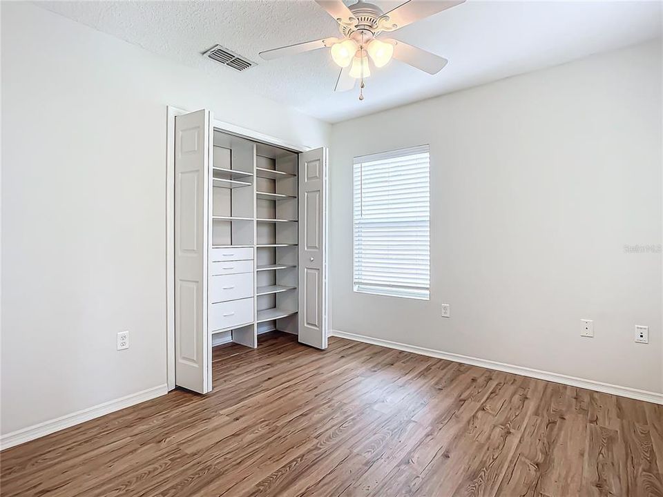 2nd bedroom with closet organizer