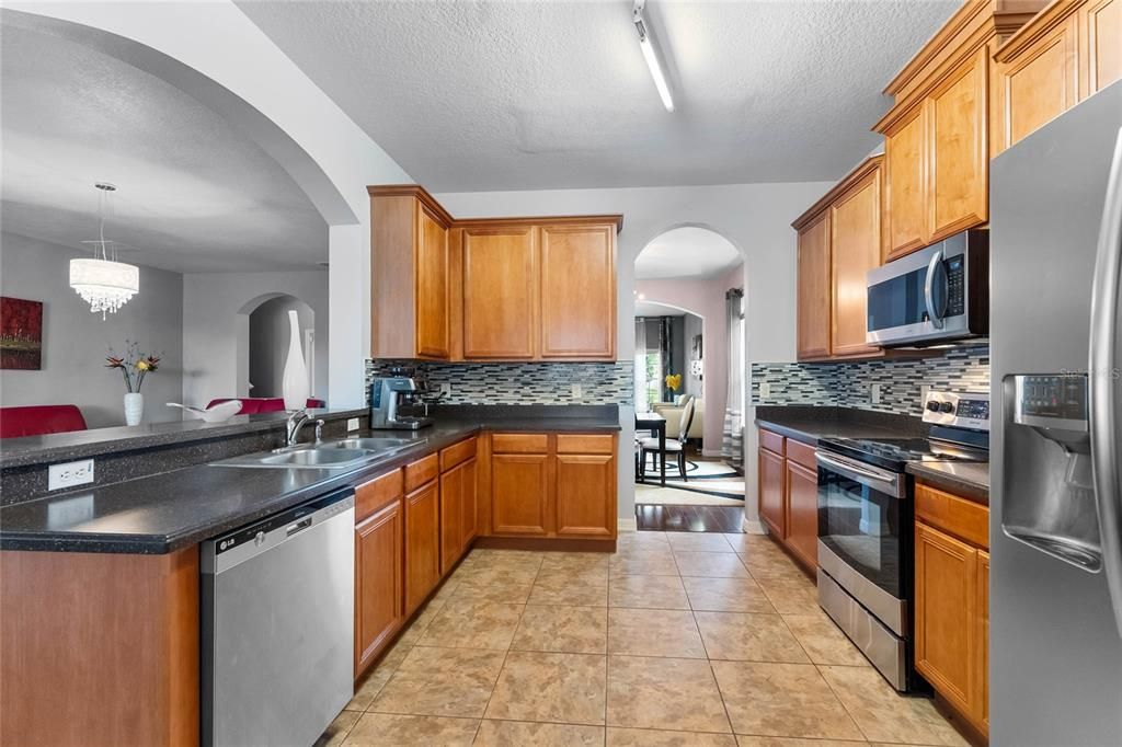 Granite Countertop with Breakfast BAr