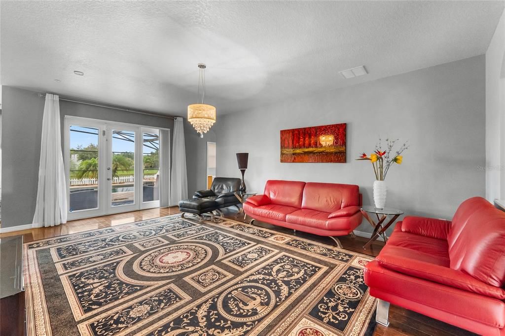 Family Room overlooking Pool/Pond. Double Pane French Doors.