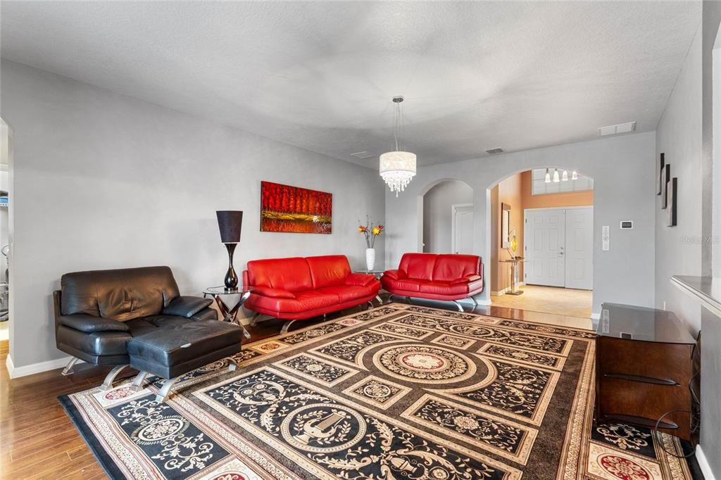 Family room with Front door and Foyer in background.