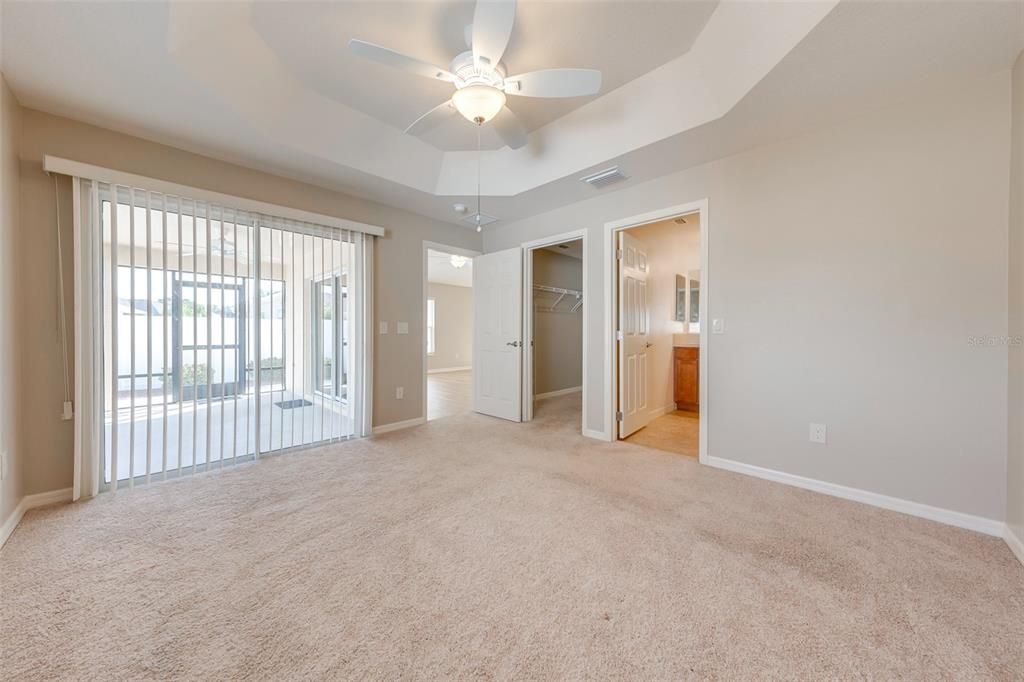 Primary Room with sliding doors to sun room