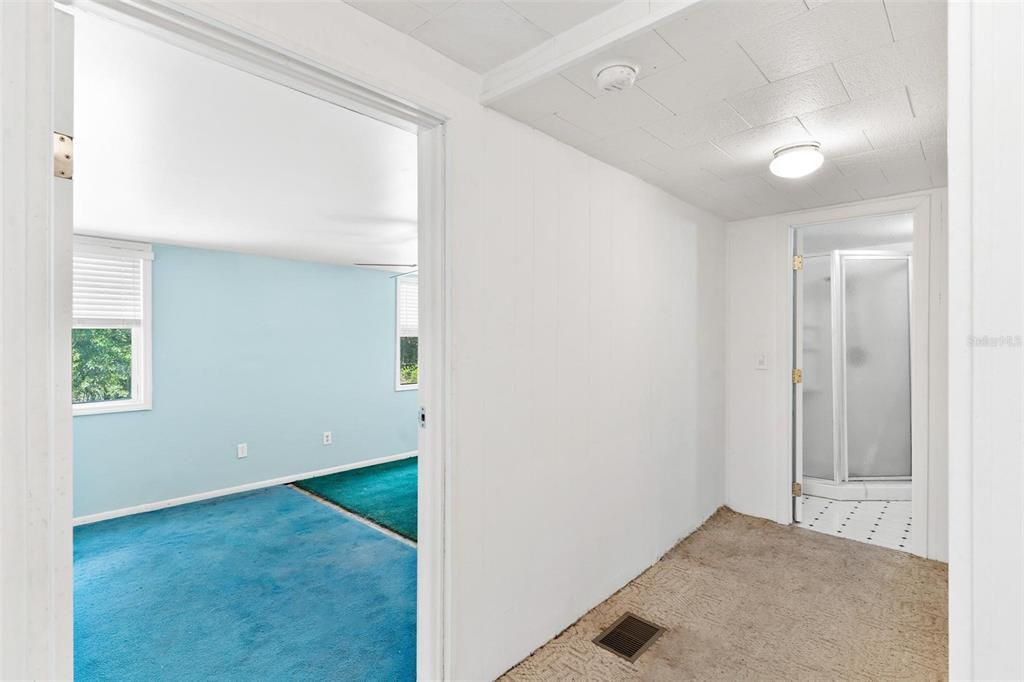 Hall between LARGE bedroom and full bath