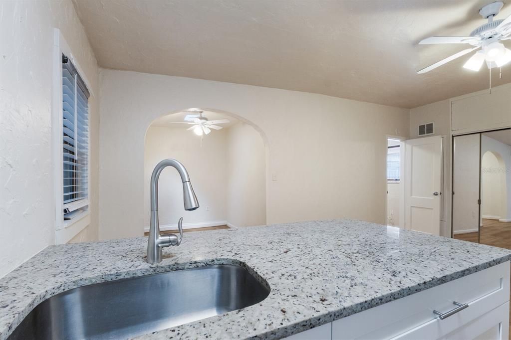 Kitchen looking into living room