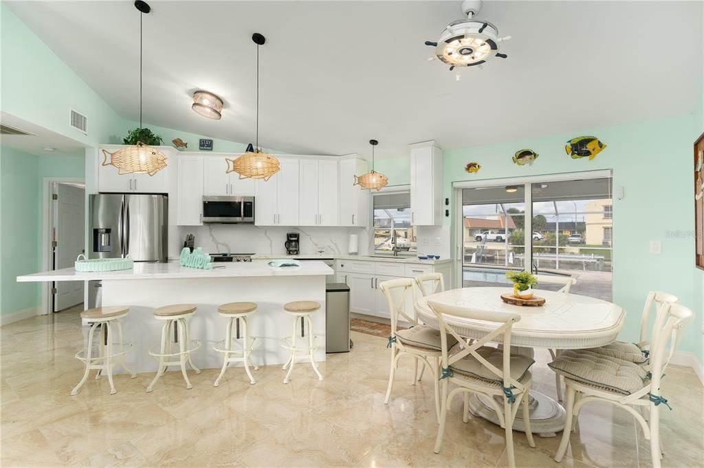 Kitchen featuring stainless steel appliances, a cente