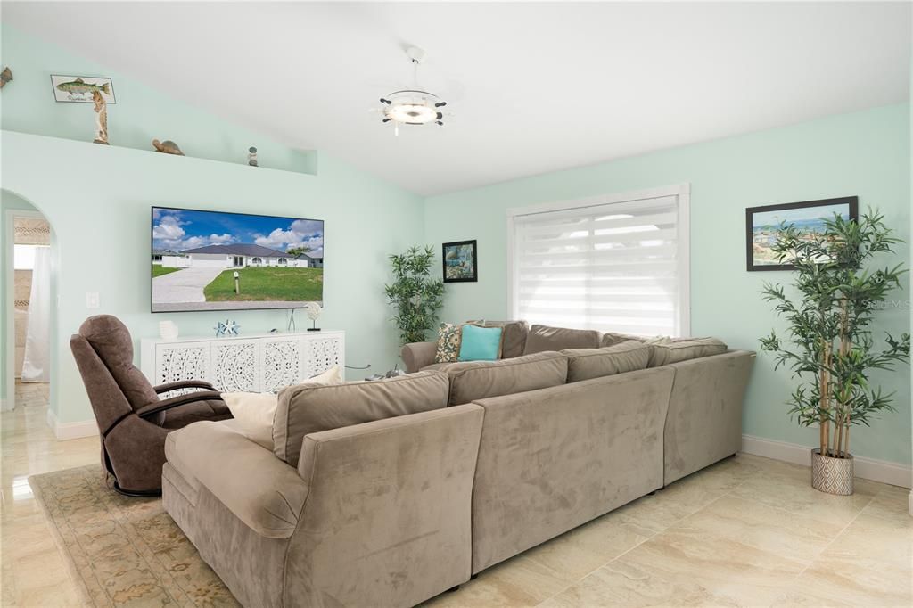 Tiled living room with vaulted ceiling