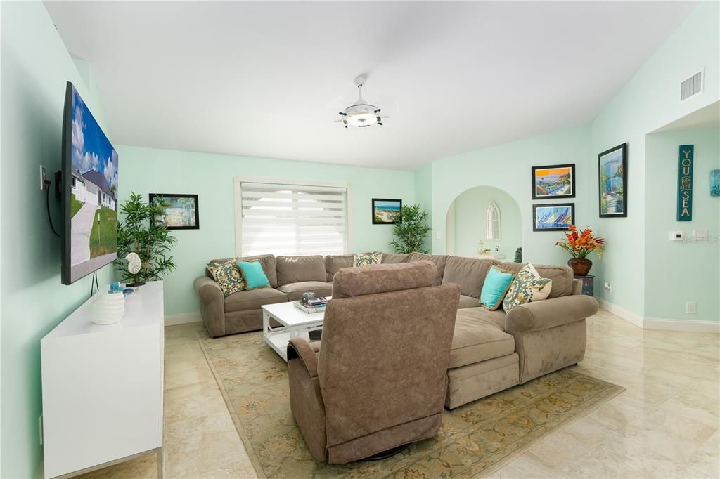 Living room featuring light tile flooring