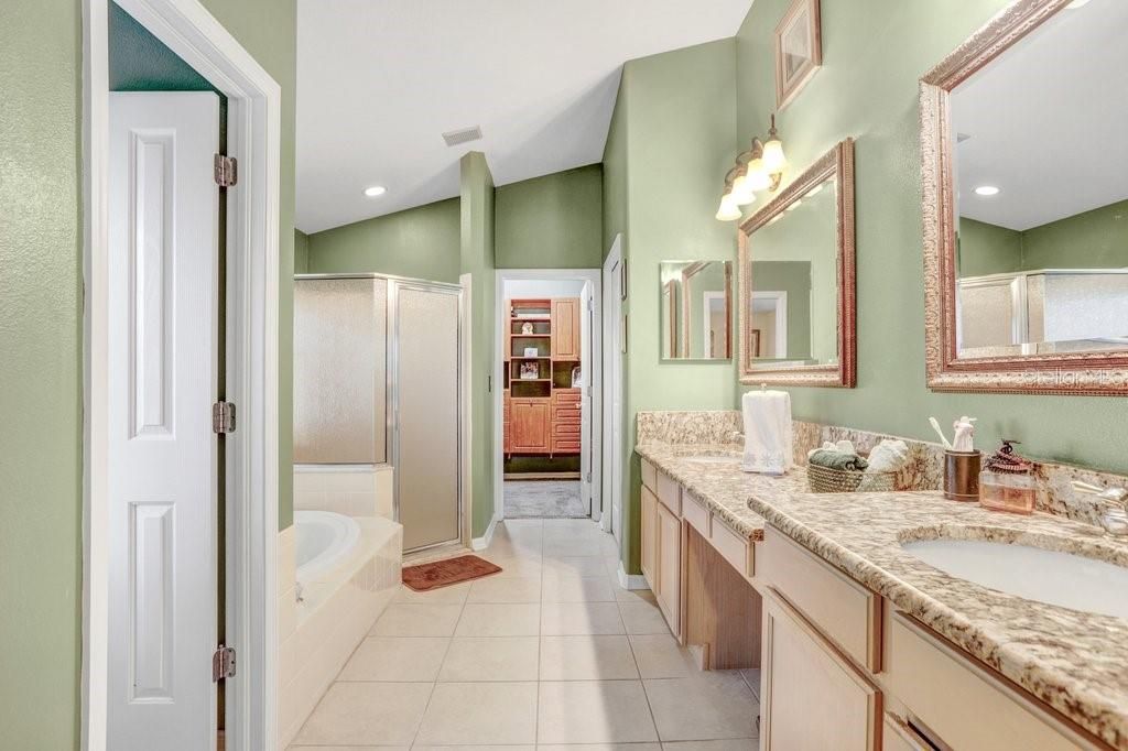 Double Sink Bathroom with separate shower,  toilet, and bath tub