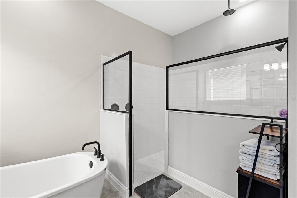 Primary Bathroom with Double Sink Quartz Counter Vanity, Soaking Tub and Walk-in Shower