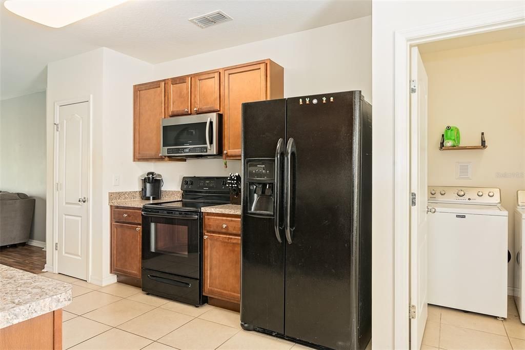 Centrally located Kitchen offers all the appliances.