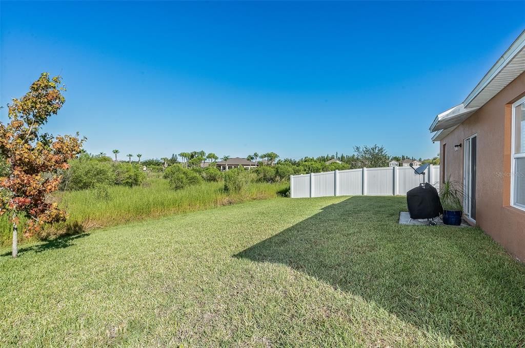 Backyard view over towards the side fencing - can connect to it and keep the privacy Fence going!!