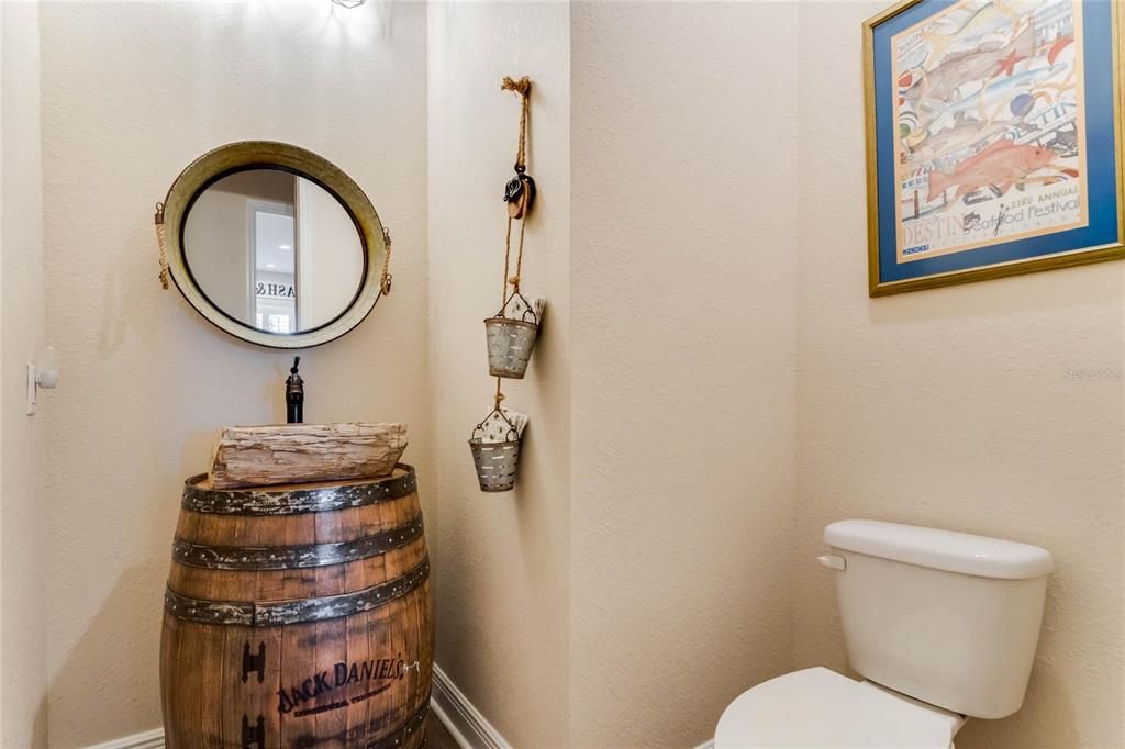 1/2 bath Main house, 1st floor. Petrified wood sink on Jack Daniels barrel