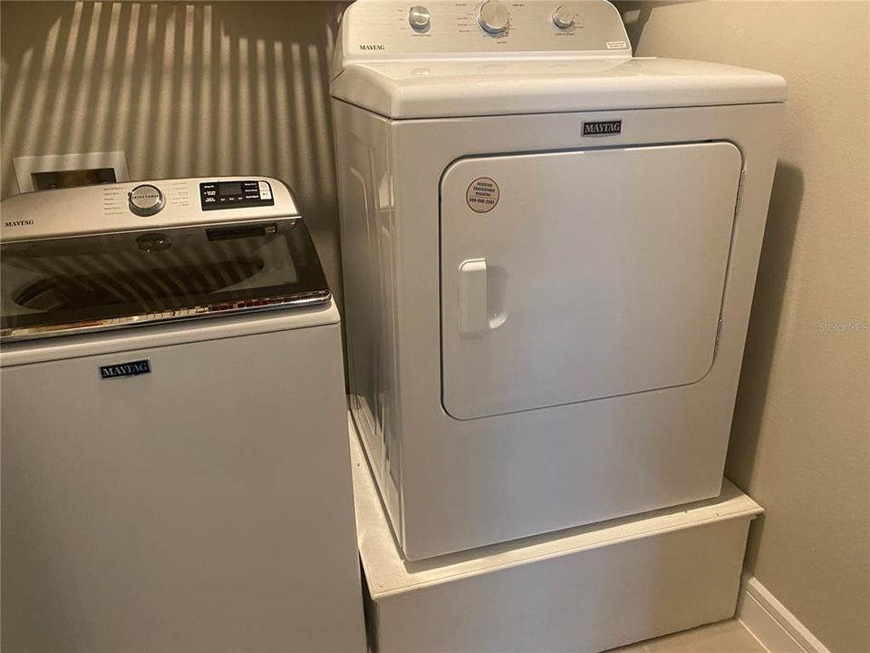 Laundry with Maytag washer and dryer