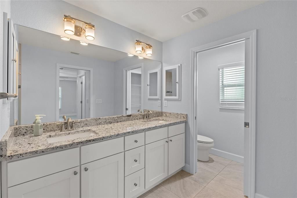 Master Bath with double sinks and Water closet