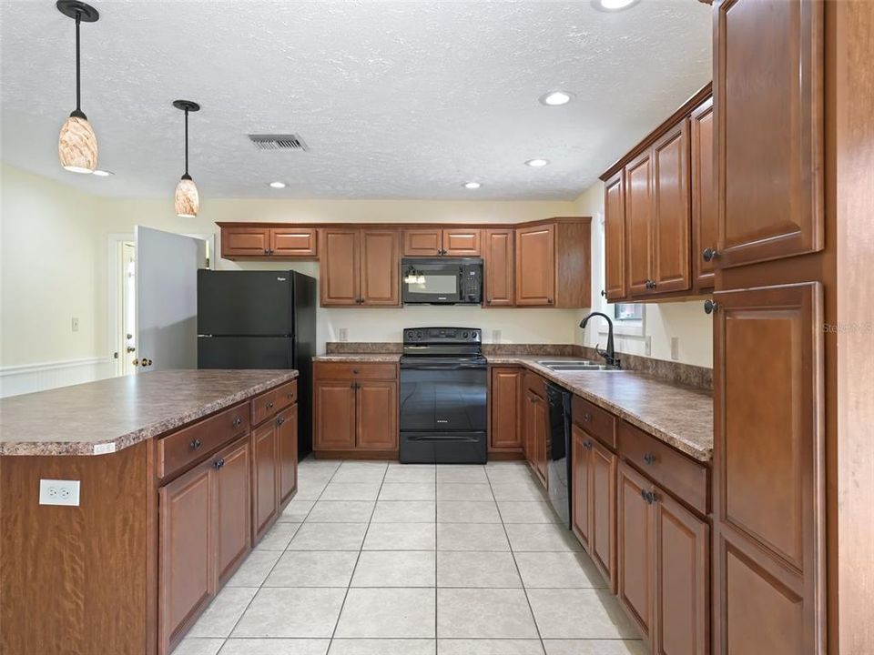 Lots of storage in this kitchen plus a new stove