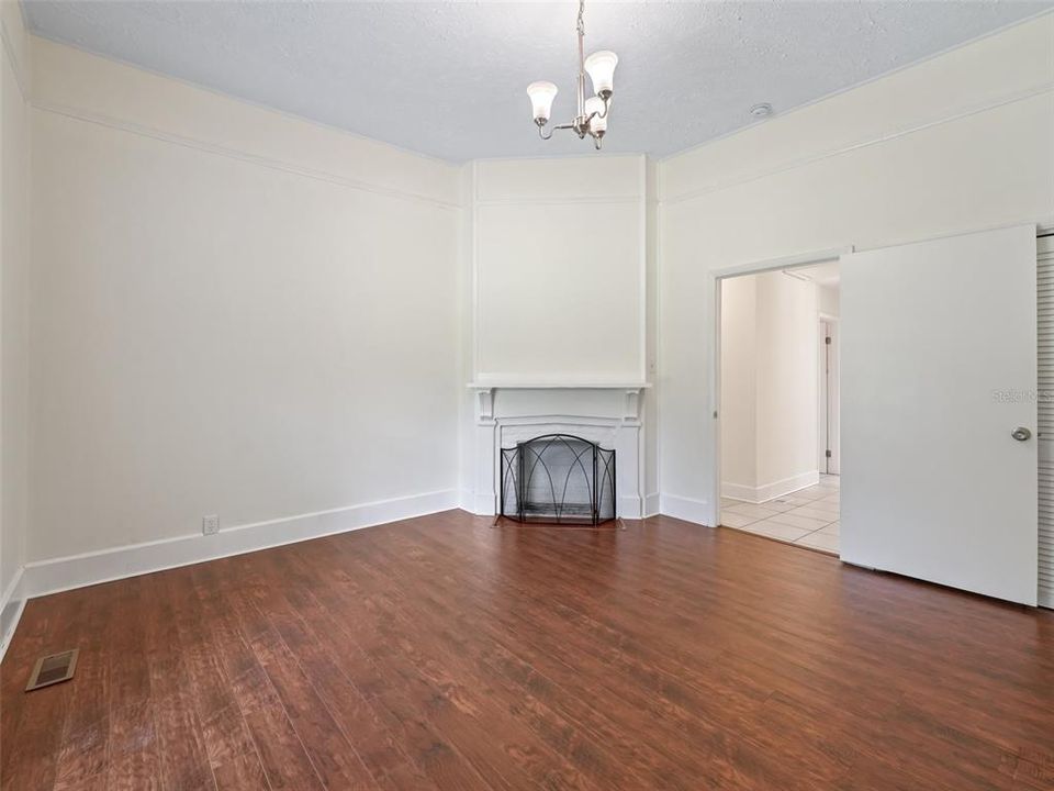 Looking across main bedroom - note the decorative corner fireplace