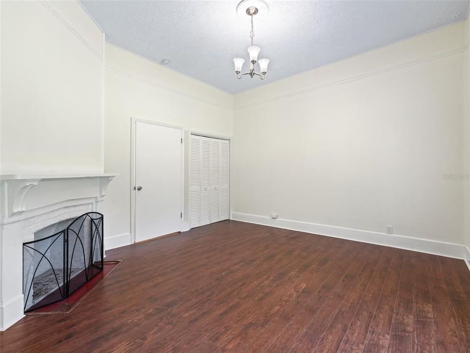 Main bedroom showing closet and entry door.