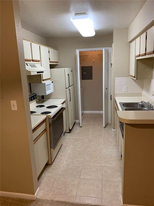 Laundry closet is next to the kitchen