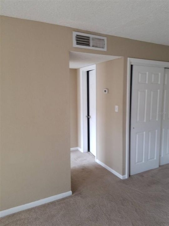 Hallway leading to the bathroom and bedroom