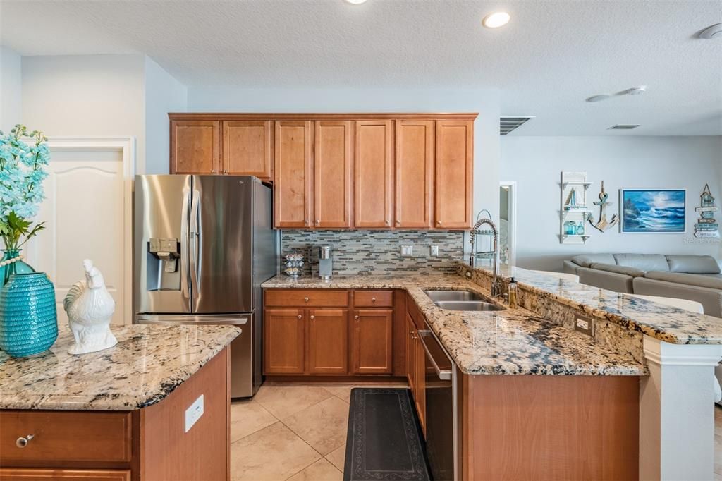 Stainless Steel Appliances, Granite Countertops, Tile Flooring on the diagonal and open to the family room.