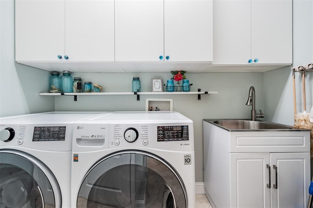 Laundry Room, Sink and lots of cabinet space.