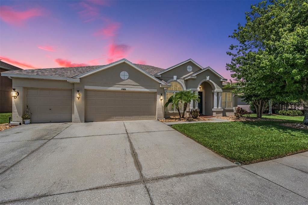 Front Exterior, 4 Bedrooms/3 Bathrooms/3 Car Garage one story with a pool and office.