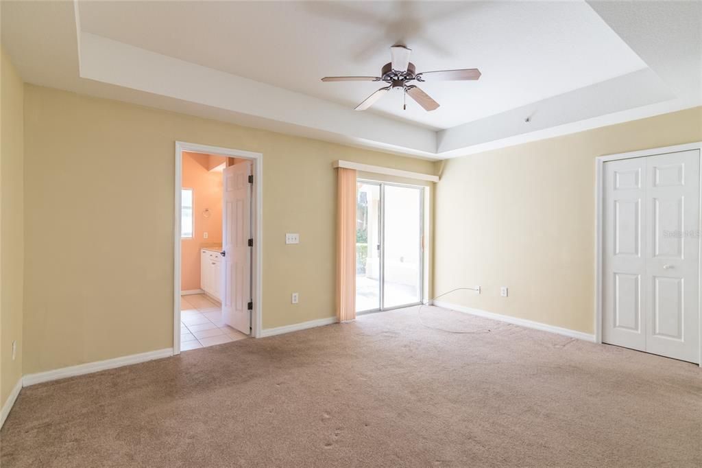 Another view of the Master bedroom showing sliding doors to the lanai and Master bathroom