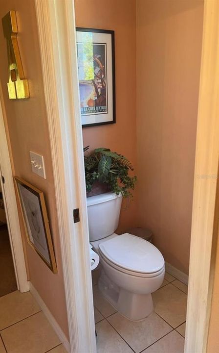 Master bathroom private toilet and bidet room with pocket door.