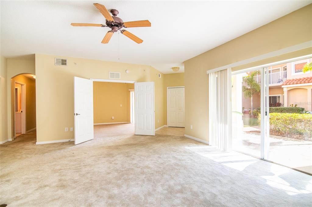 Entry door to living room.  3rd bedroom/office with French doors and sliding doors to  one of two covered lanais.