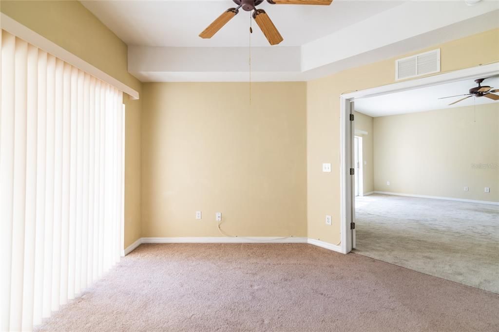 3rd bedroom with closet and French Doors could be a home office.  Sliding doors lead to large covered lanai.