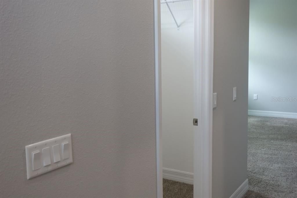 Entrance to laundry, bedroom 3, bedroom 4 and shared full bathroom