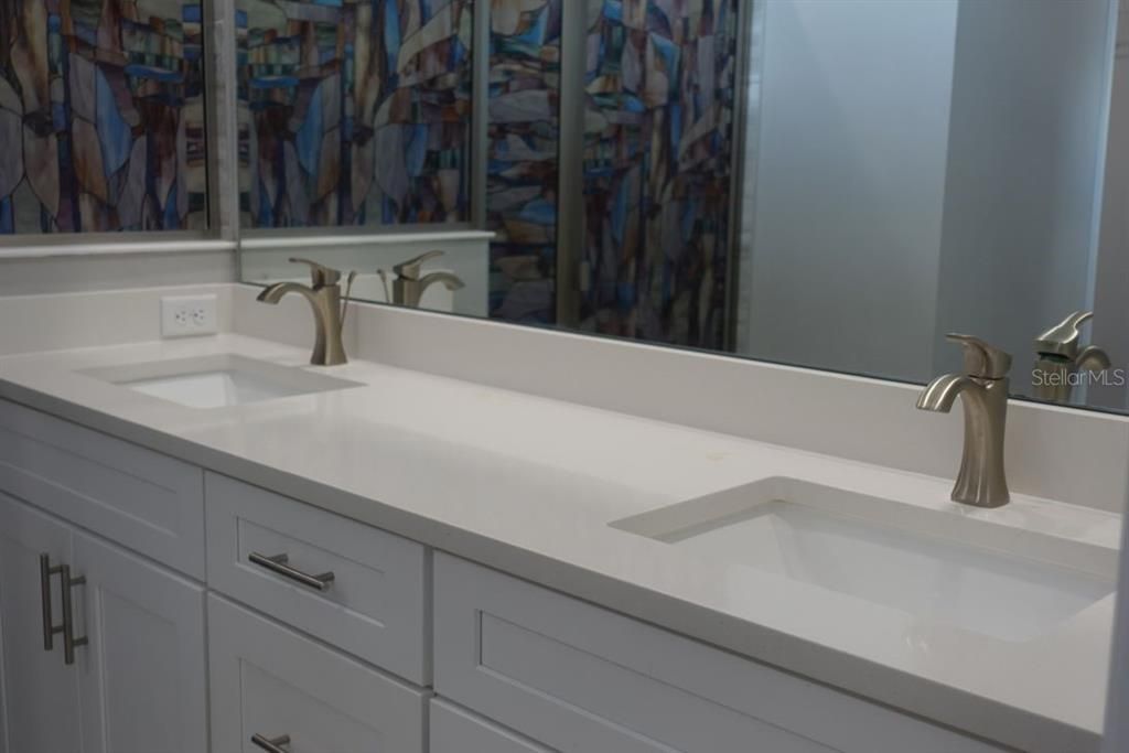 Primary bathroom vanity double sink area.