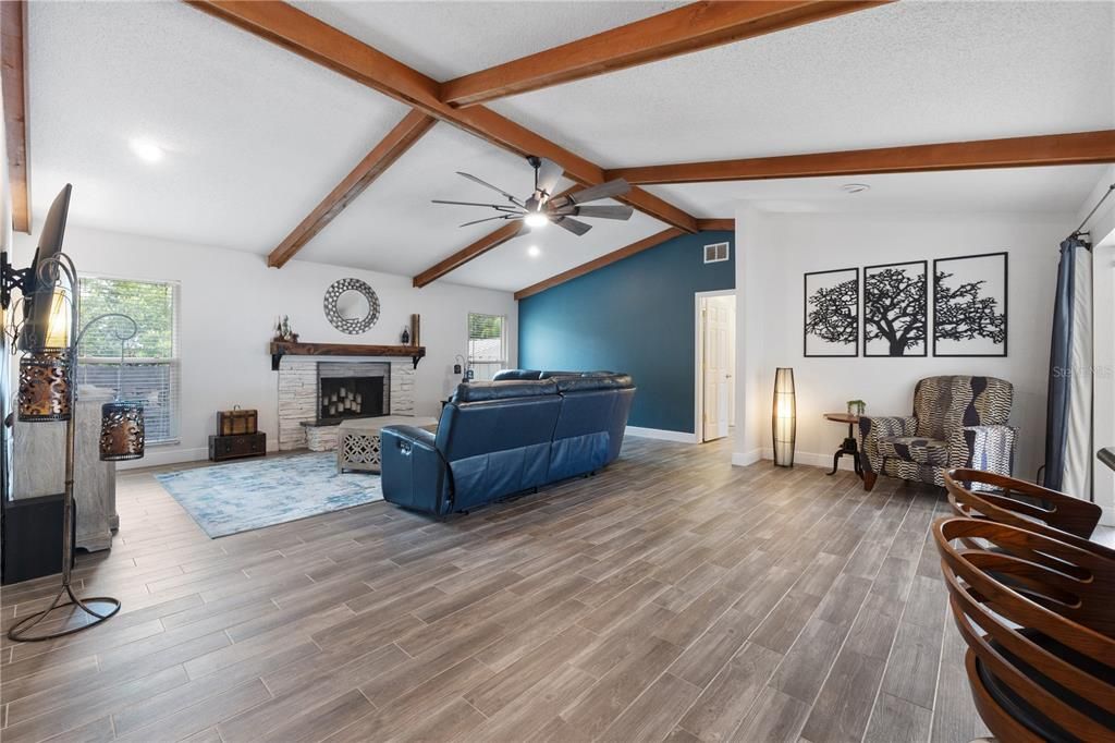 Very spacious family room complemented with wood beams in the vaulted ceiling!